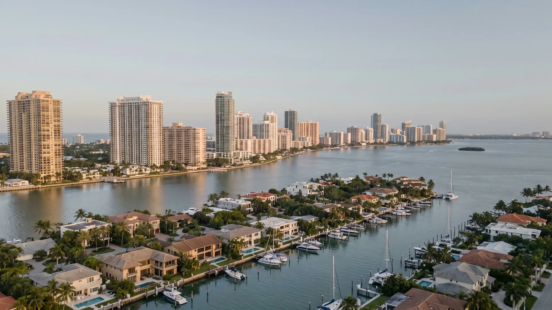 Aerial view of Biscayne Bay with Miami Beach residential towers and waterfront homes on the Venetian Islands.