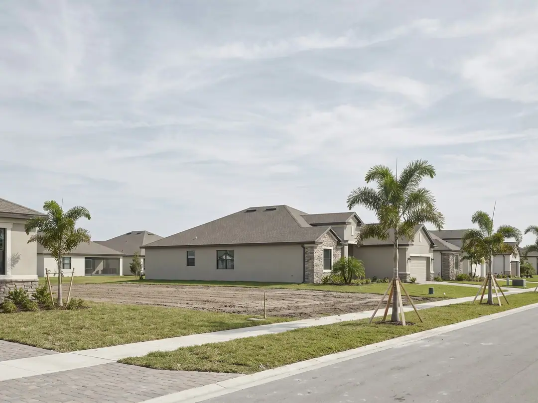 New single-family homes with unfinished yards in a Palm Beach County subdivision.